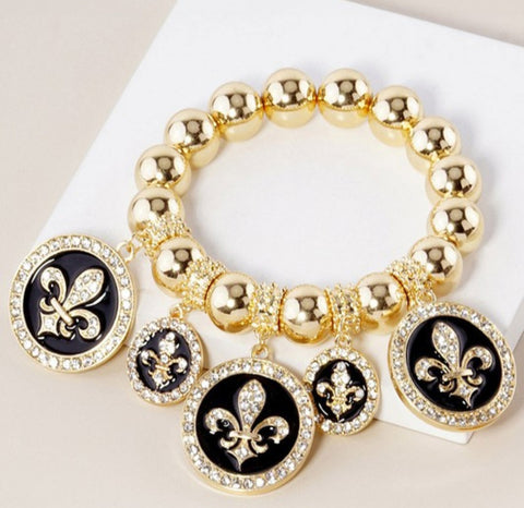 New gold fleur charm bracelet