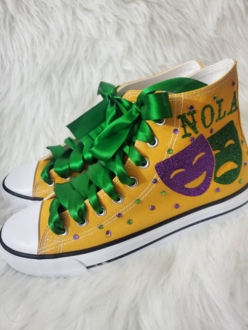 Online option no longer available (may be available in store)Mardi Gras shoes gold w/green laces (ladies sizes)
