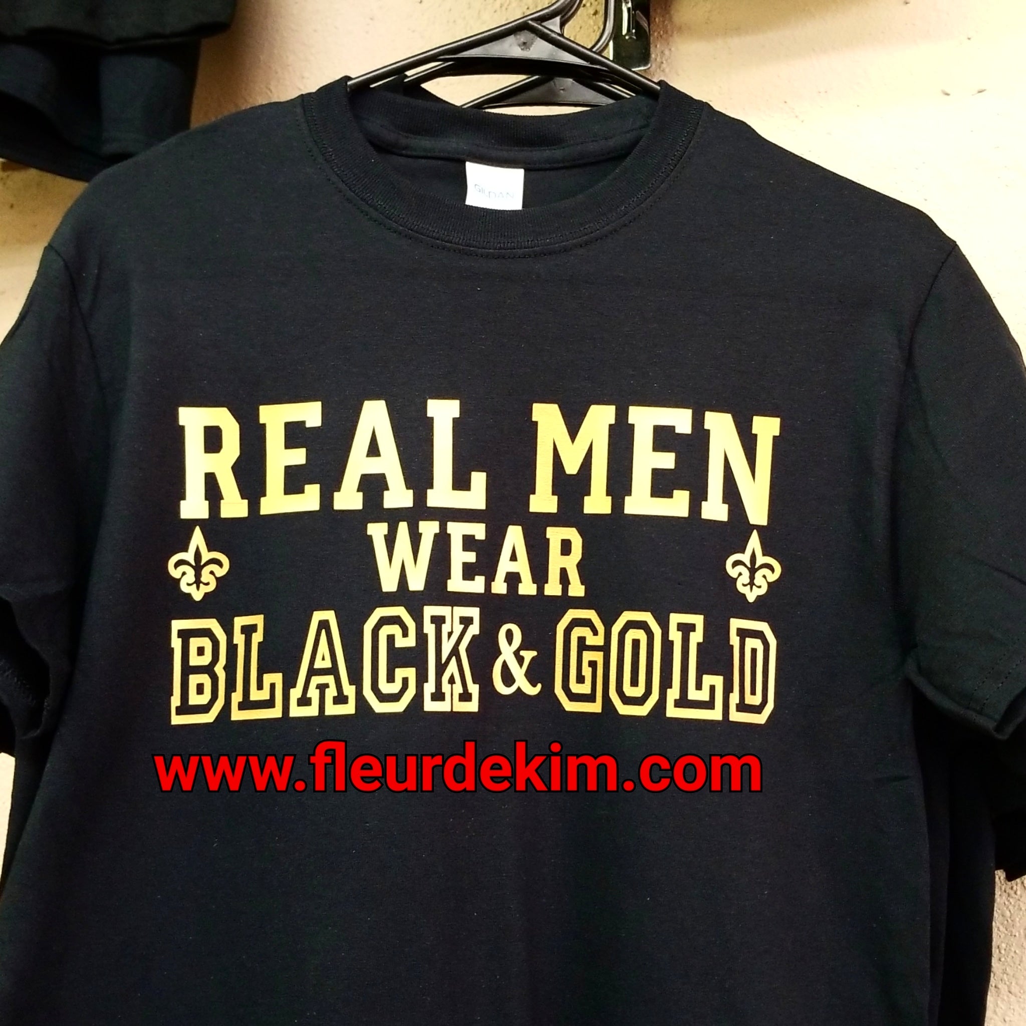 "Real Men" wear black & gold tshirt